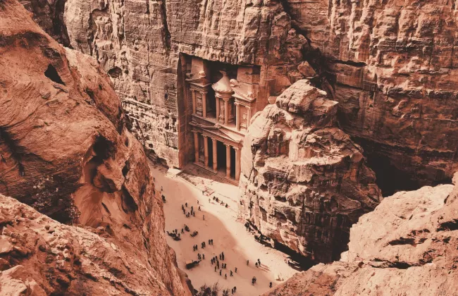 Petra’s rock-carved architecture in Jordan, with reddish sandstone cliffs.