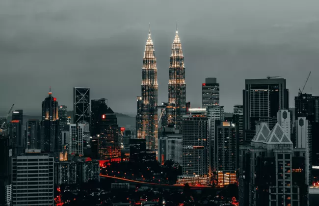 Modern city skyline with tall towers.