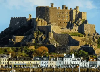 Mont Orgueil Castle in Jersey, perched on a hill above the coastline.