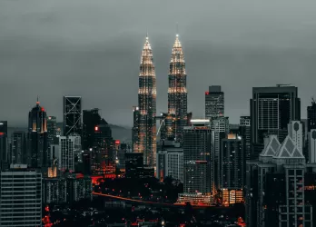Modern city skyline with tall towers.