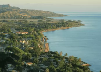 A coastal town with houses built on cliffs overlooking the sea.