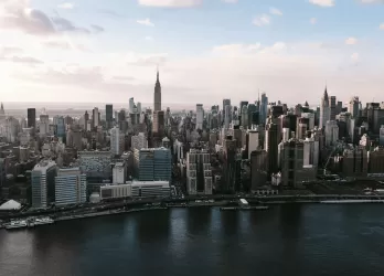 Aerial view of New York City skyline with Manhattan skyscrapers and rivers.