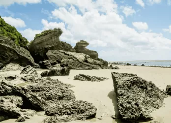 White sandy beach with clear blue water.
